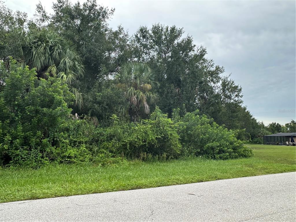 124 Sunset Boulevard East Punta Gorda, FL 33982 - Photo 3 of 4 a view of a street with a trees