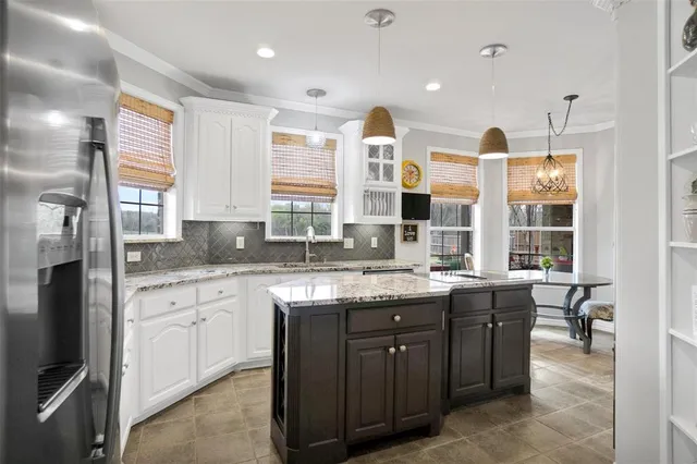 a kitchen with a sink stove and cabinets