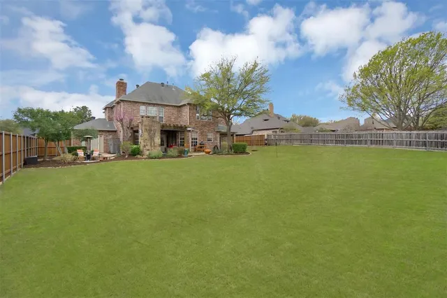 a view of a lake with a house in the background