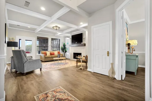 a living room with furniture fireplace and a flat screen tv