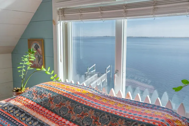 a view of a dining room with furniture and a potted plant
