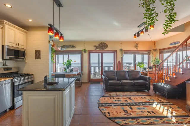 an aerial view of a house with a garden and lake view