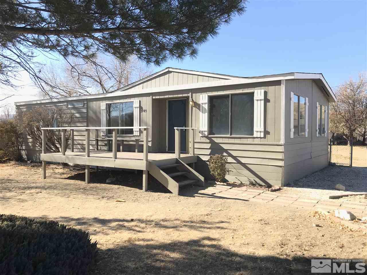 3985 Goldfinch Drive Reno, NV 89508 - Photo 1 of 15 a front view of a house with a yard