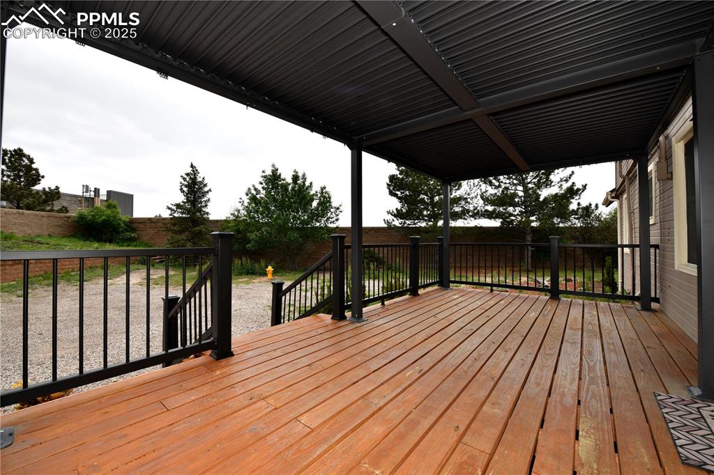 1275 Berglind Road Colorado Springs, CO 80920 - Photo 15 of 30 a view of deck with wooden floor and outer view