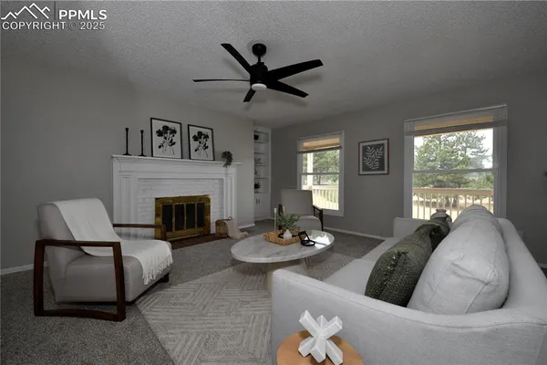 a living room with furniture and a fireplace