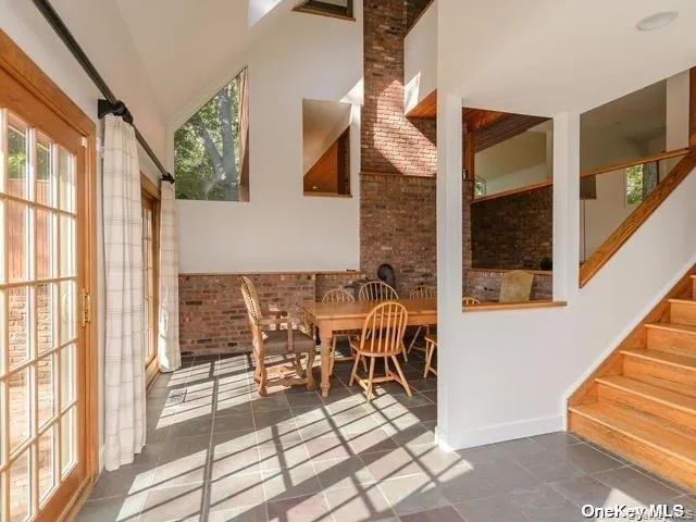a kitchen with a refrigerator and a stove top oven