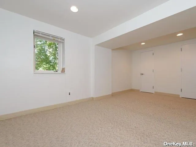 a view of an empty room with windows