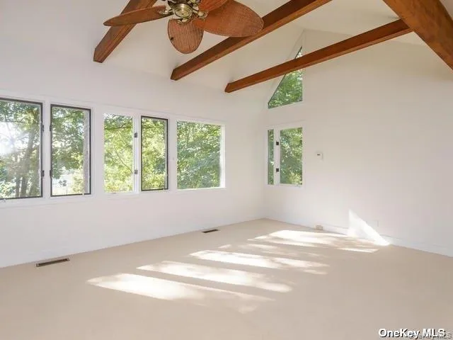 a bathroom with a sink a shower a mirror and a bathtub