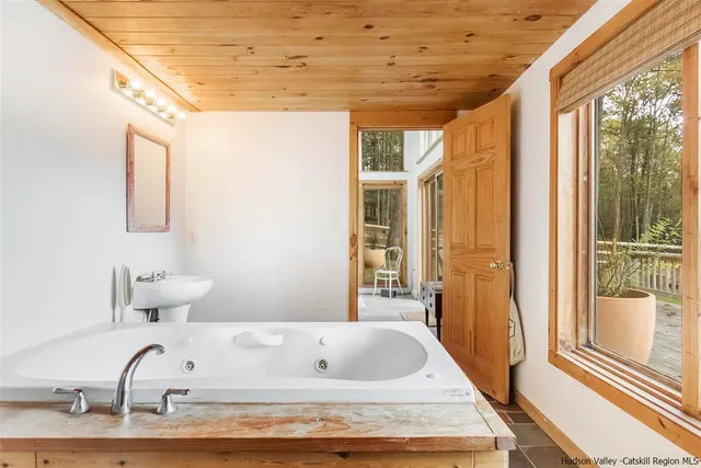 a bathroom with a bathtub and a shower