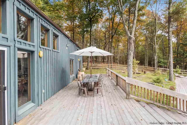 a view of a chair and table in the balcony