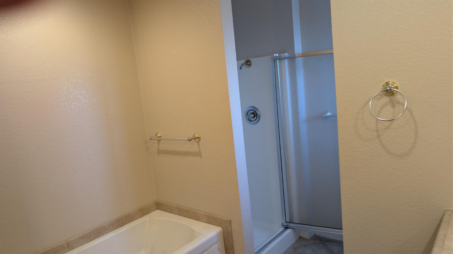 3248 Sudbury Road Cameron Park, CA 95682 - Photo 21 of 41 a bathroom with a glass shower door
