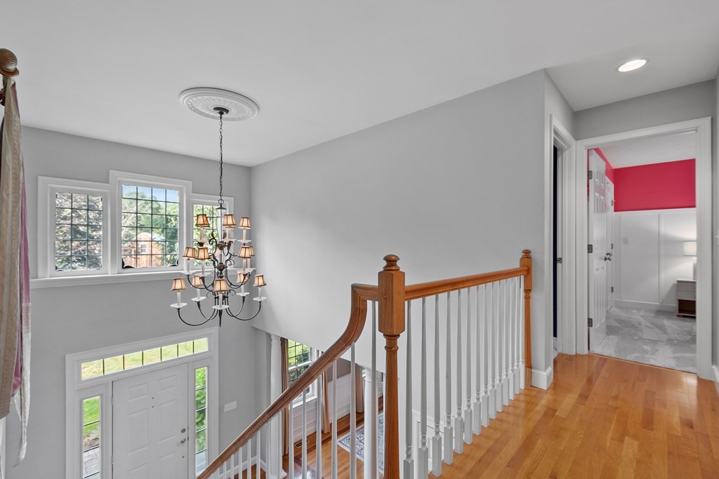 298 Old Harvard Road Boxborough, MA 01719 - Photo 18 of 42 a view of a hallway with a chandelier