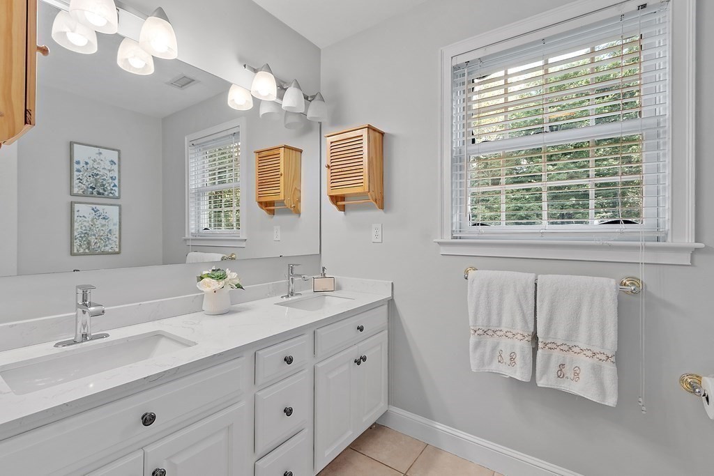 298 Old Harvard Road Boxborough, MA 01719 - Photo 26 of 42 a bathroom with double vanity and a mirror