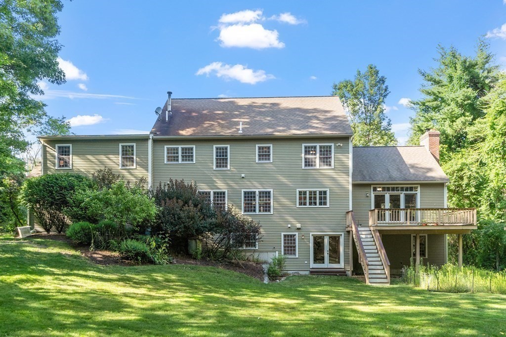 298 Old Harvard Road Boxborough, MA 01719 - Photo 3 of 42 a front view of a house with a garden