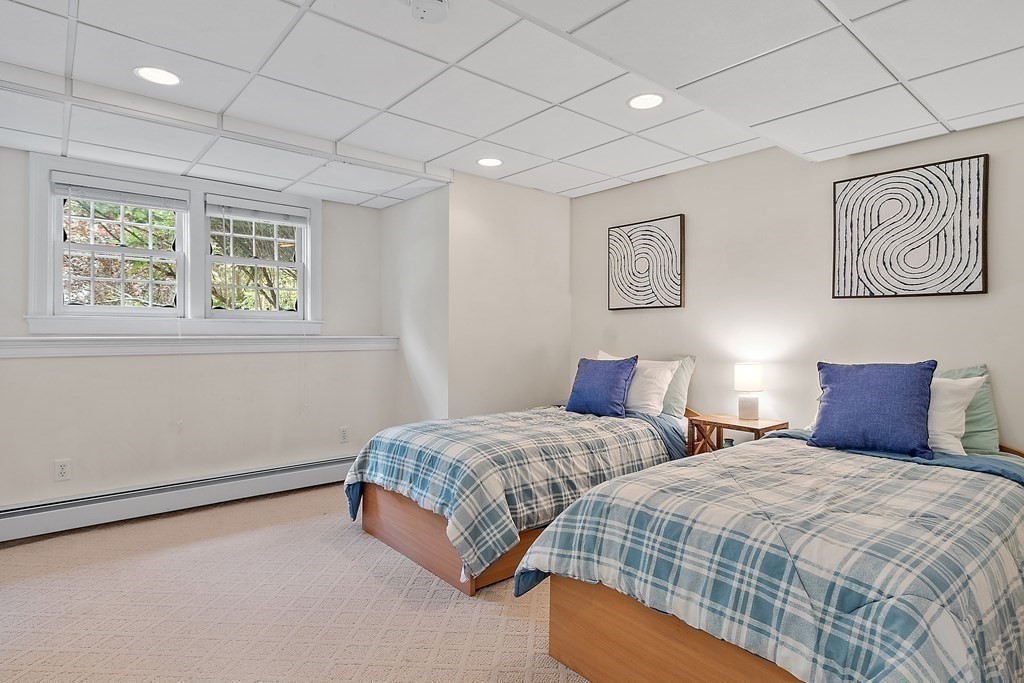 298 Old Harvard Road Boxborough, MA 01719 - Photo 34 of 42 a bedroom with two beds and a window