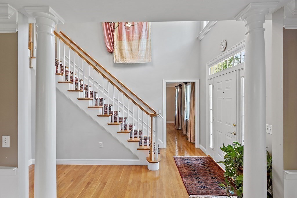 298 Old Harvard Road Boxborough, MA 01719 - Photo 5 of 42 a view of entryway and hall with wooden floor