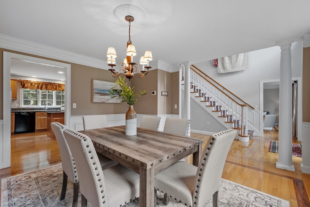 298 Old Harvard Road Boxborough, MA 01719 - Photo 6 of 42 a view of a dining room with furniture wooden floor and chandelier