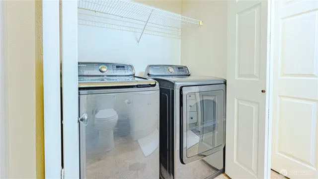a utility room with dryer and washer