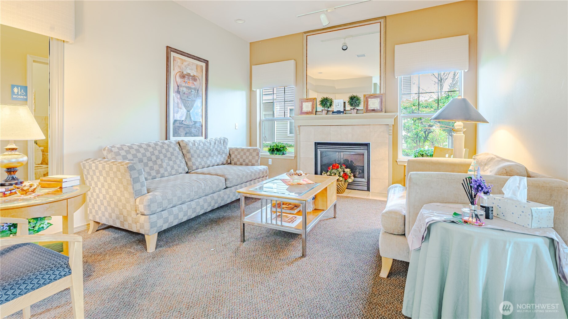 801 Rainier Avenue North, Unit G234 Renton, WA 98057 - Photo 14 of 18 a living room with furniture and a fireplace