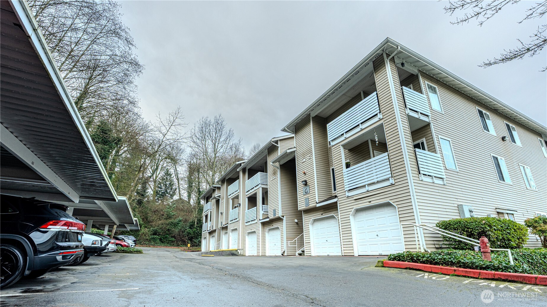 801 Rainier Avenue North, Unit G234 Renton, WA 98057 - Photo 16 of 18 a view of a car park in front of house