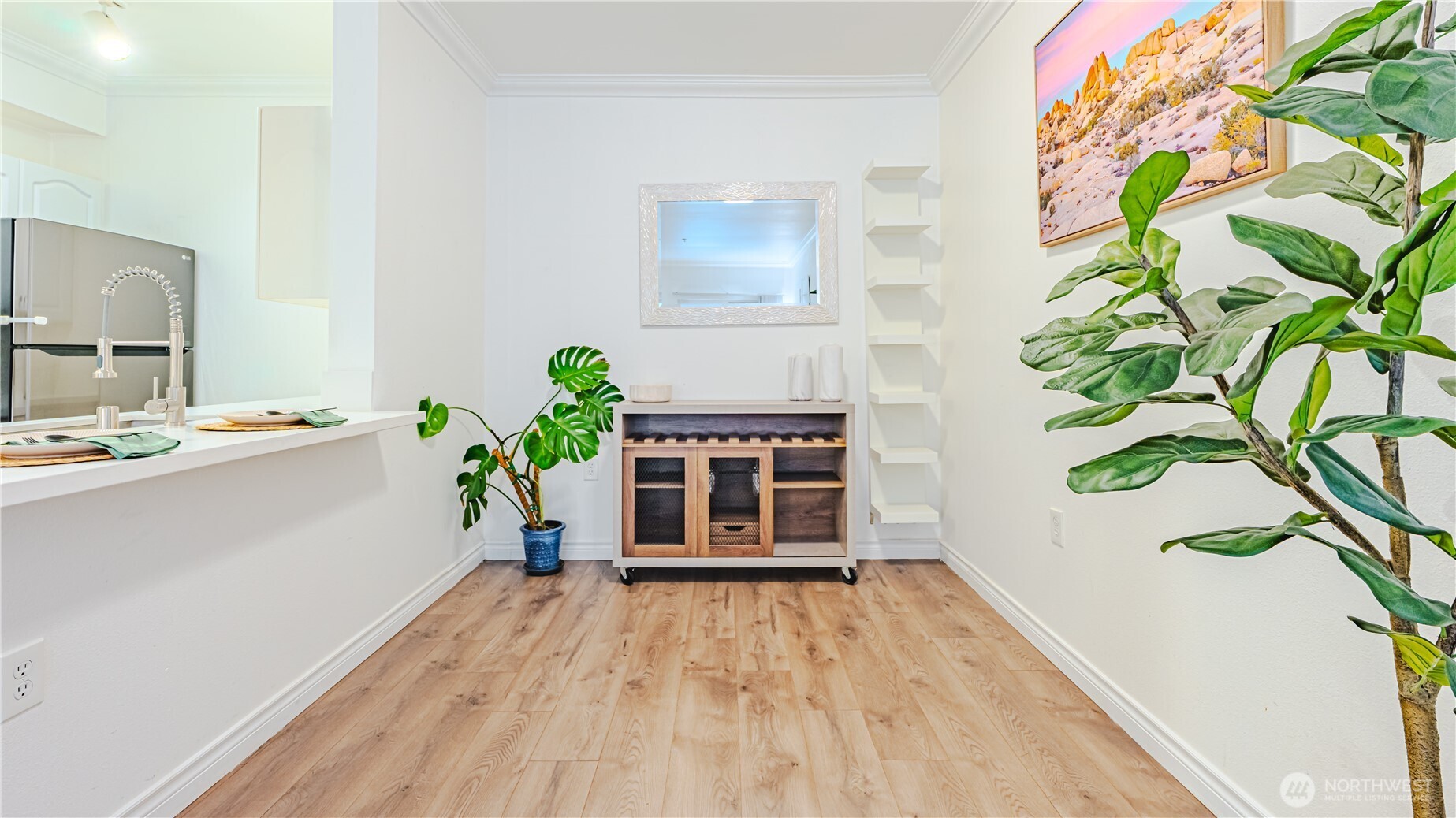 801 Rainier Avenue North, Unit G234 Renton, WA 98057 - Photo 5 of 18 a view of a hallway with wooden floor and front door
