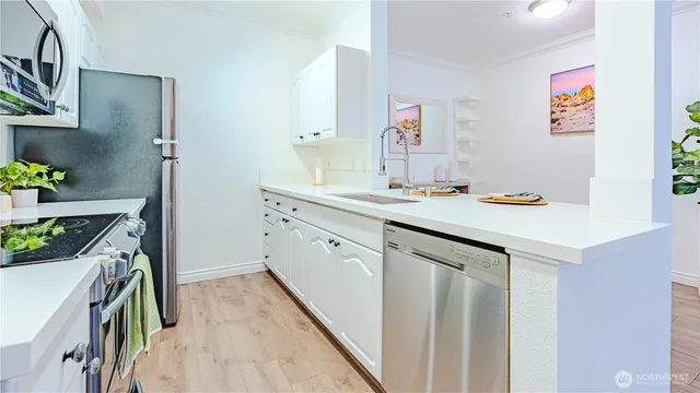 a utility room with sink dryer and washer
