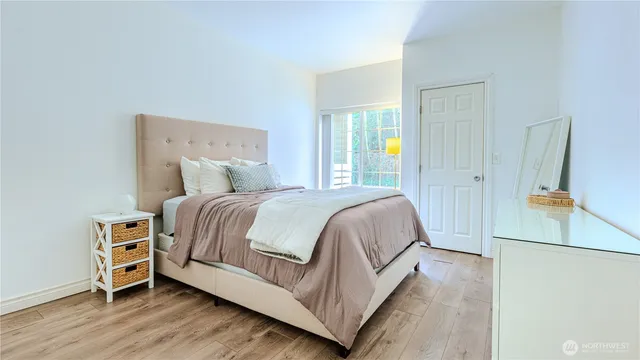 a bedroom with a bed and a dresser