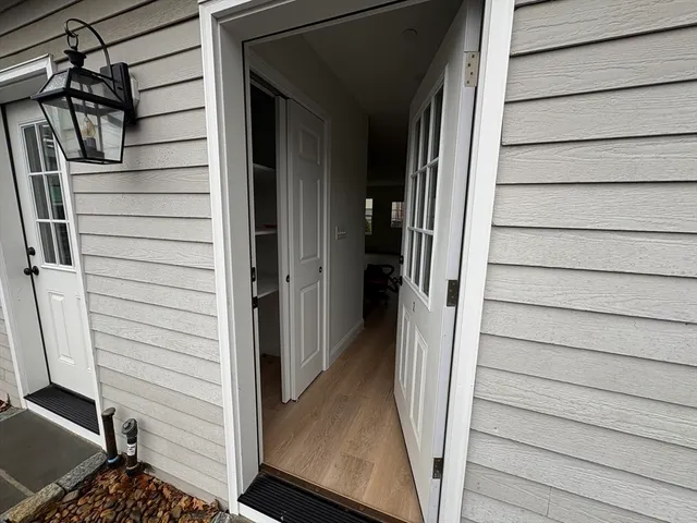 a view of front door and deck of the house