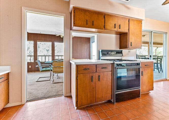 41000 Oak Ridge Drive Three Rivers, CA 93271 - Photo 12 of 39 a kitchen with stainless steel appliances granite countertop a stove a sink and a refrigerator