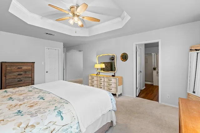 a bedroom with a bed and a dresser