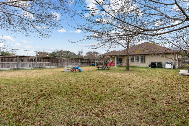 a view of a house with a yard porch and sitting area