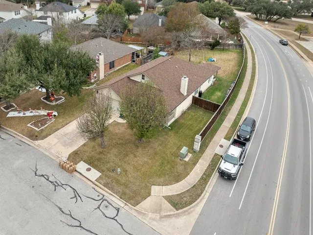 an aerial view of residential houses with outdoor space