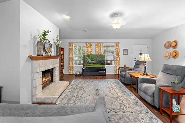 a living room with furniture and a fireplace