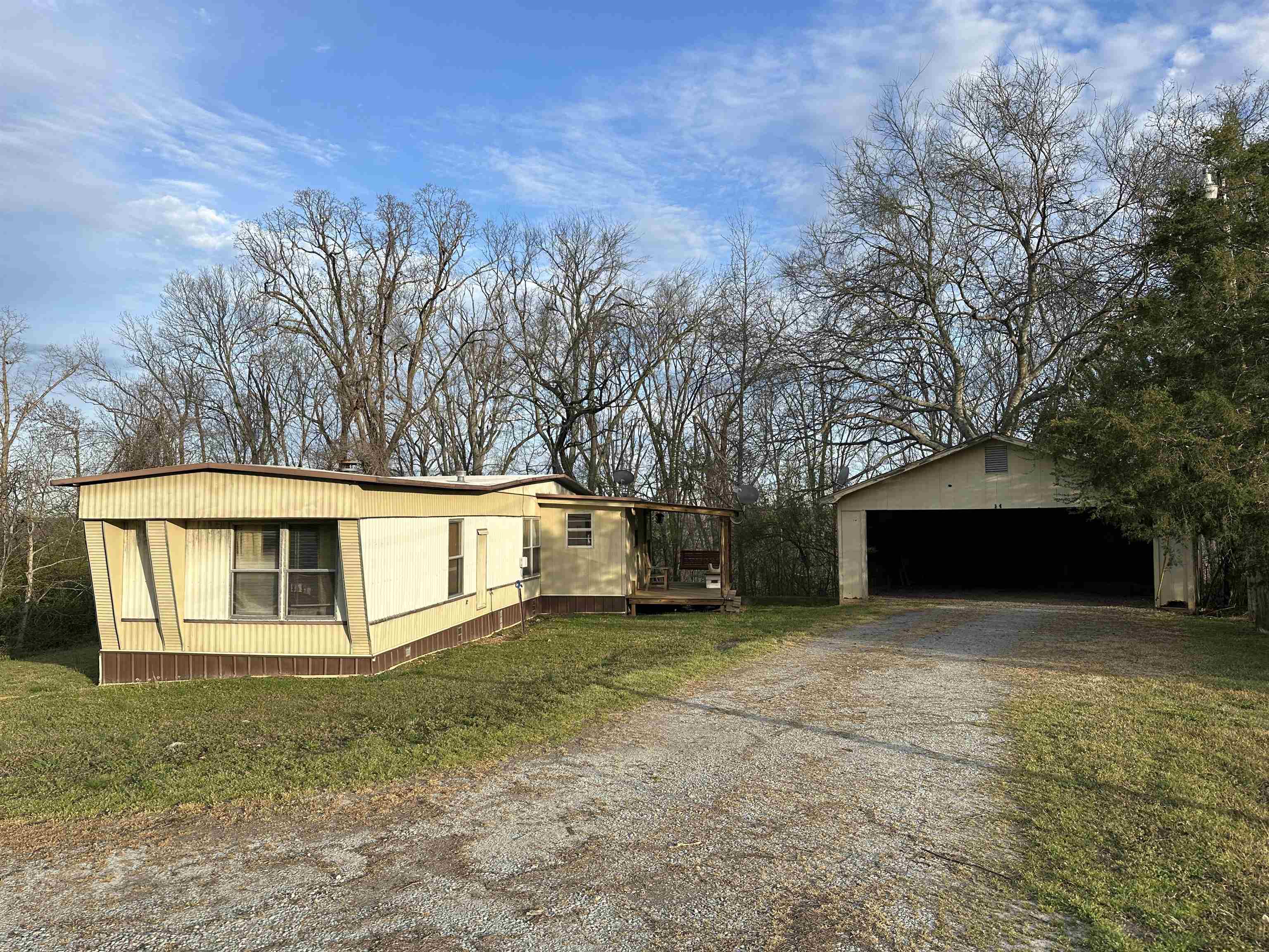 65 Cooksey Lane Michie, TN 38357 - Photo 1 of 40 a view of a house with a yard