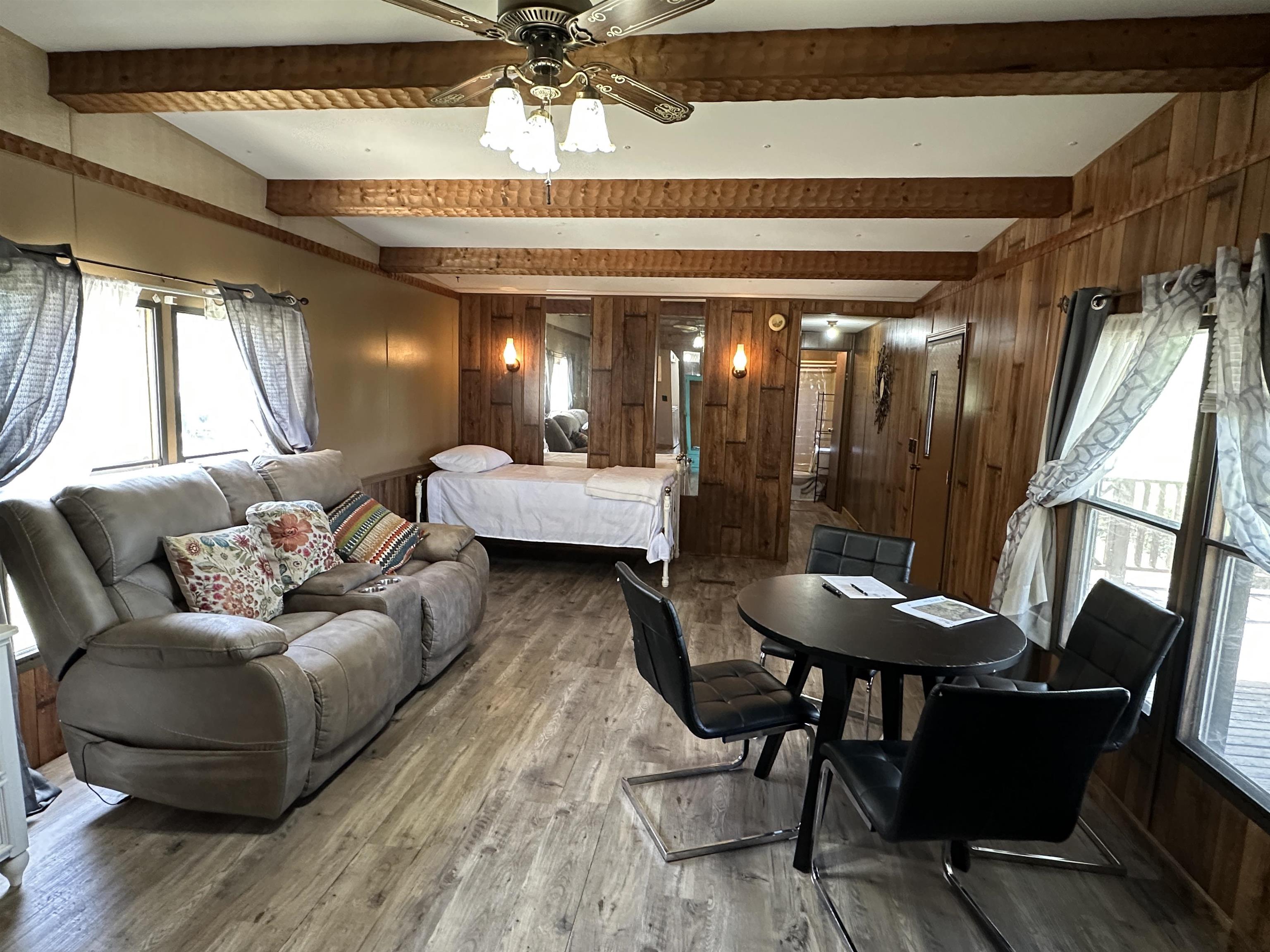 65 Cooksey Lane Michie, TN 38357 - Photo 11 of 40 a living room with furniture and a large window