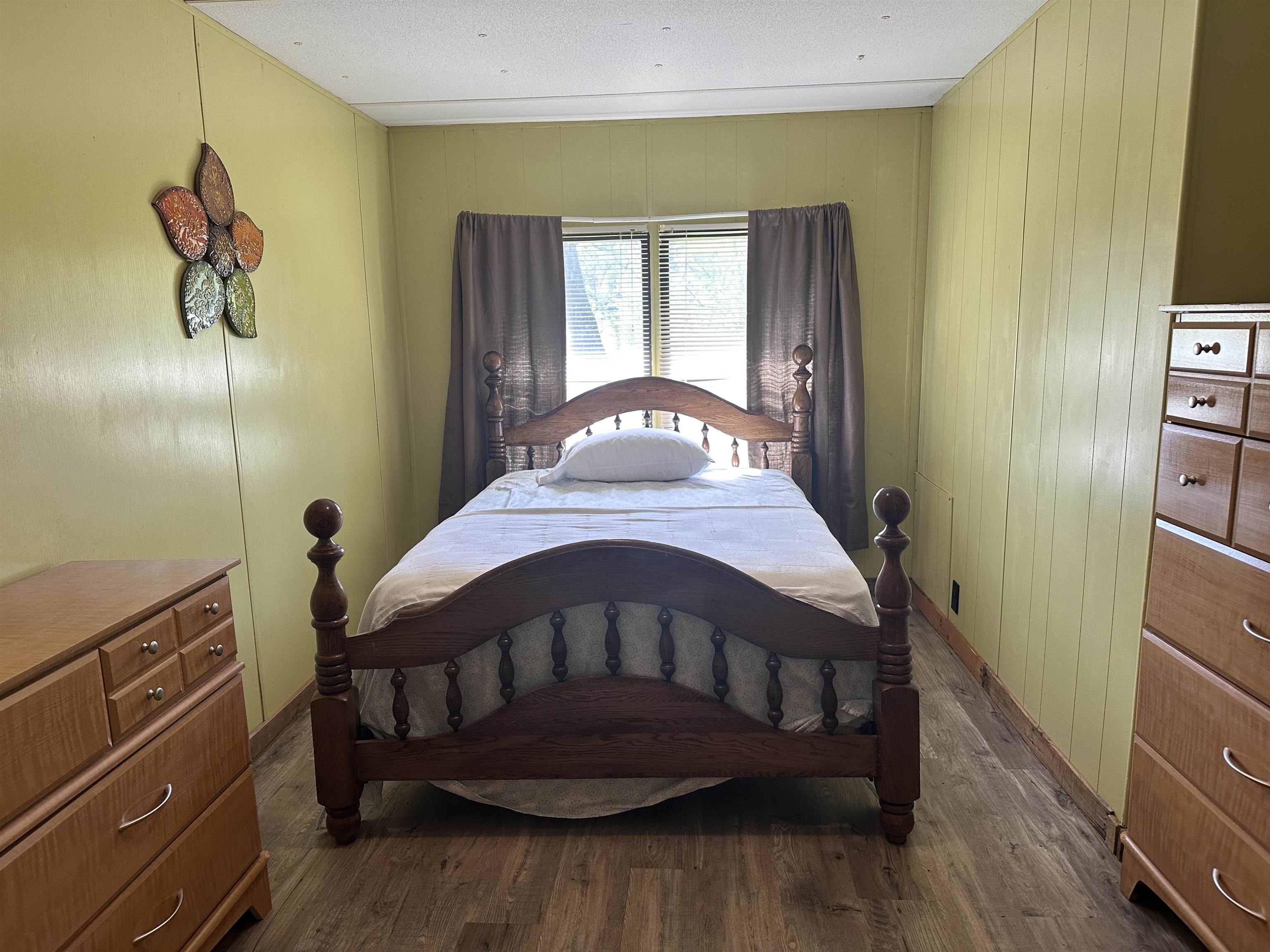 65 Cooksey Lane Michie, TN 38357 - Photo 14 of 40 a bedroom with a bed and wooden floor