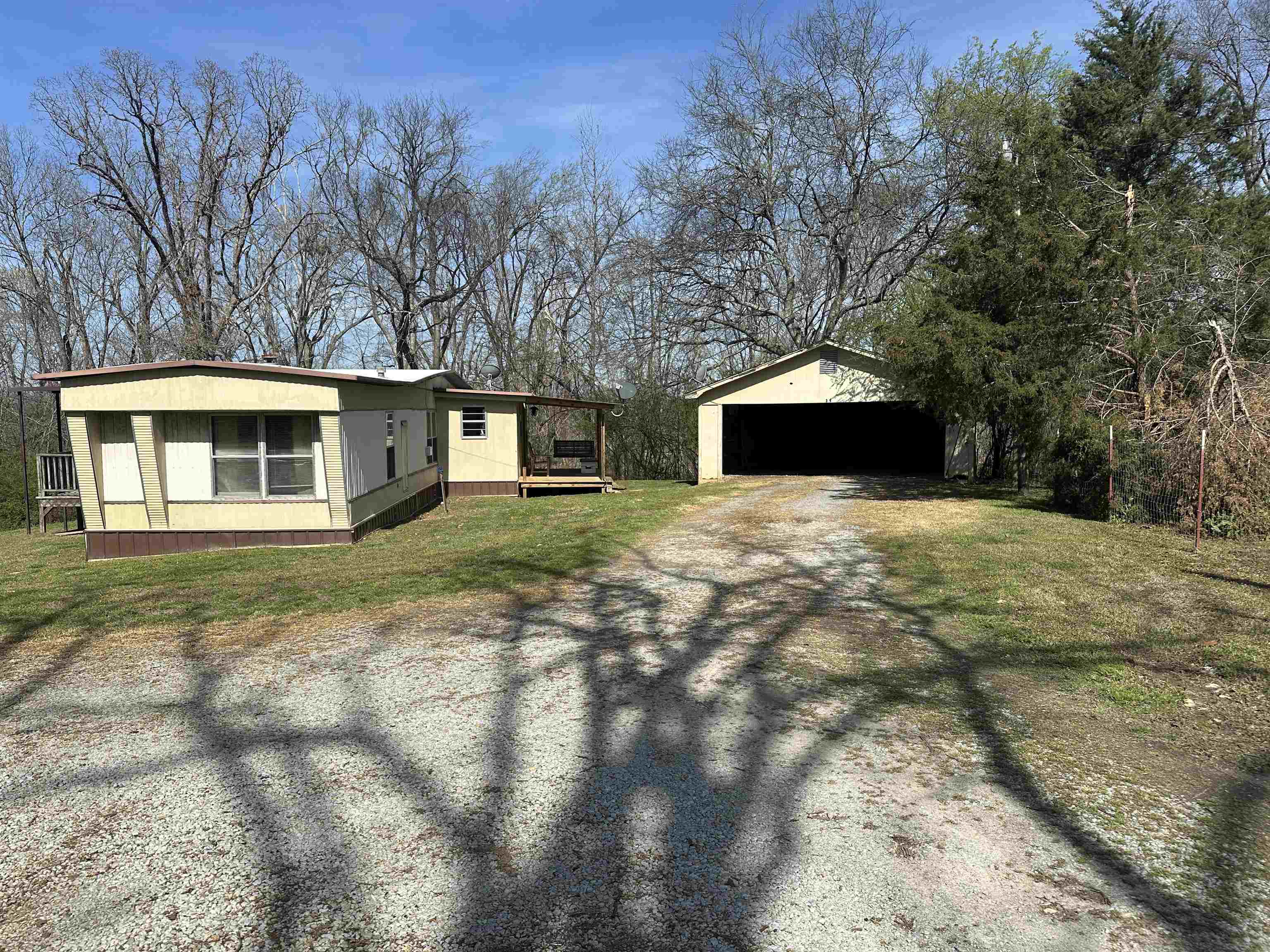 65 Cooksey Lane Michie, TN 38357 - Photo 19 of 40 a front view of a house with yard and trees