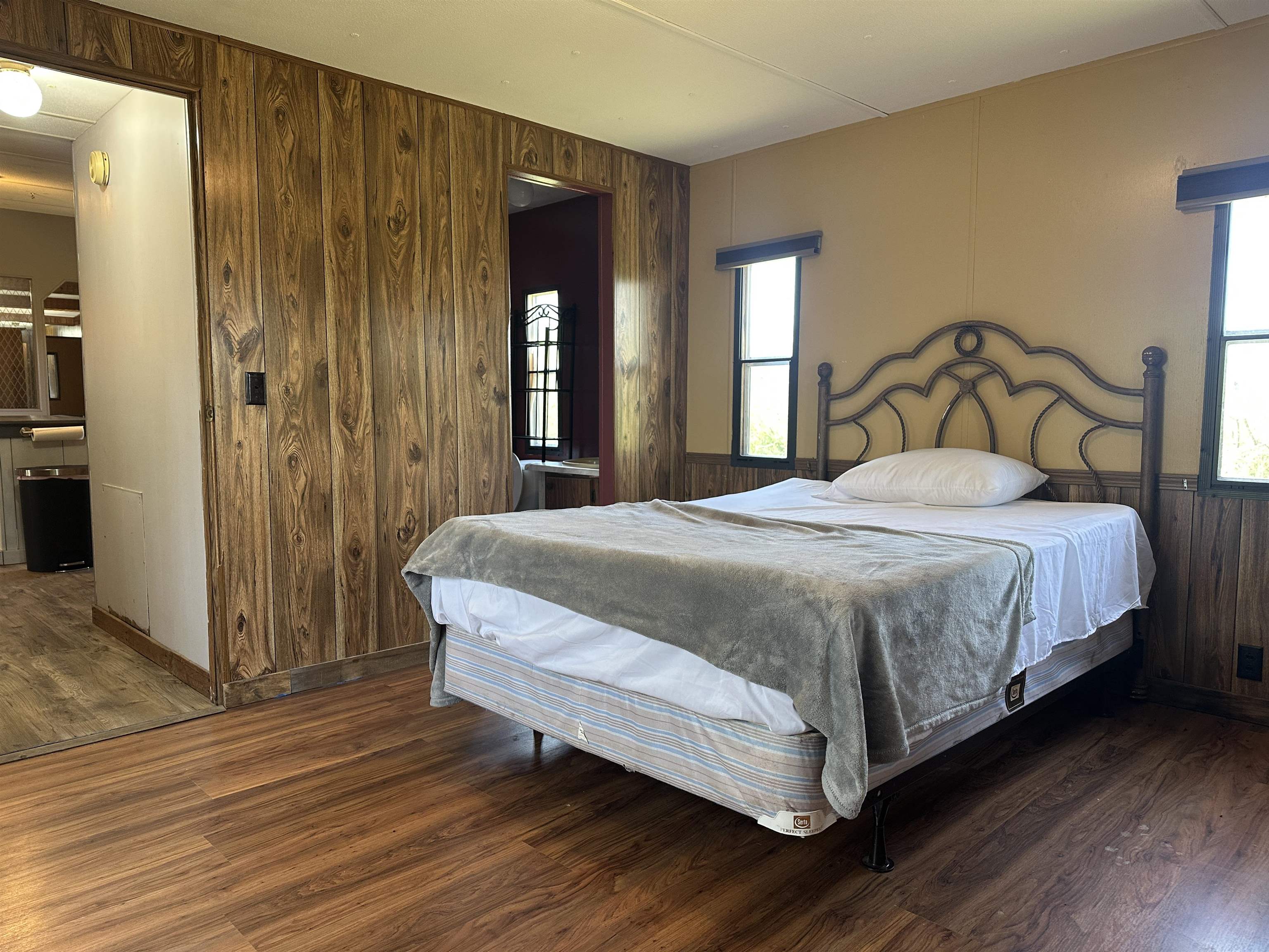 65 Cooksey Lane Michie, TN 38357 - Photo 2 of 40 a bedroom with a bed and a large mirror