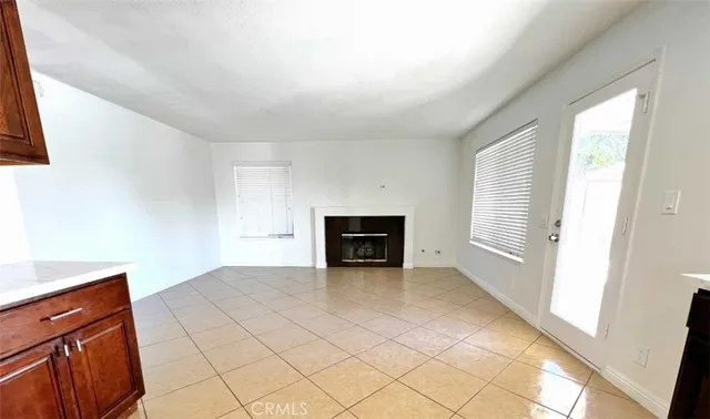 a view of a swimming pool with a patio and a yard