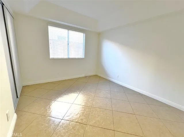 a bathroom with a granite countertop sink mirror and toilet