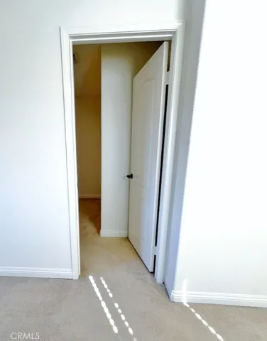 a bathroom with a double vanity sink a toilet and a mirror