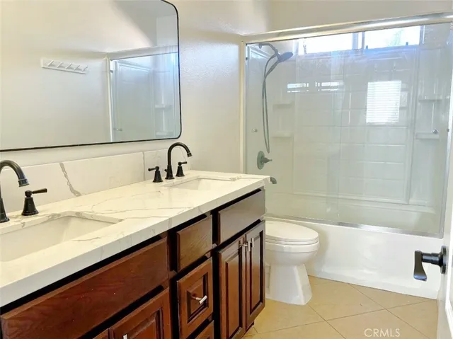 a view of a livingroom with a ceiling fan and window