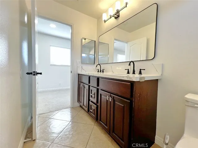 a bathroom with a tub and mirror