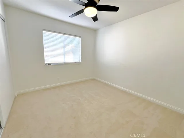 a bathroom with a sink vanity and a toilet