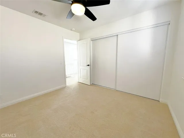 a bathroom with a shower and a mirror