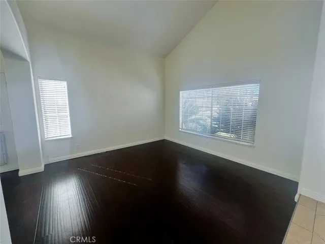 a view of wooden floor in an empty room