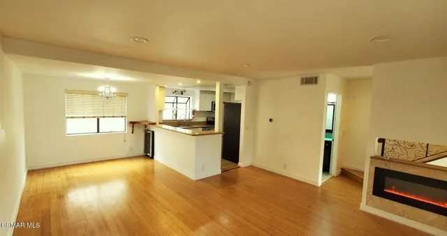 a view of a kitchen cabinets and wooden floor