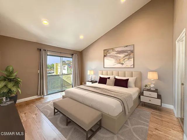 a bedroom with a bed and a couch