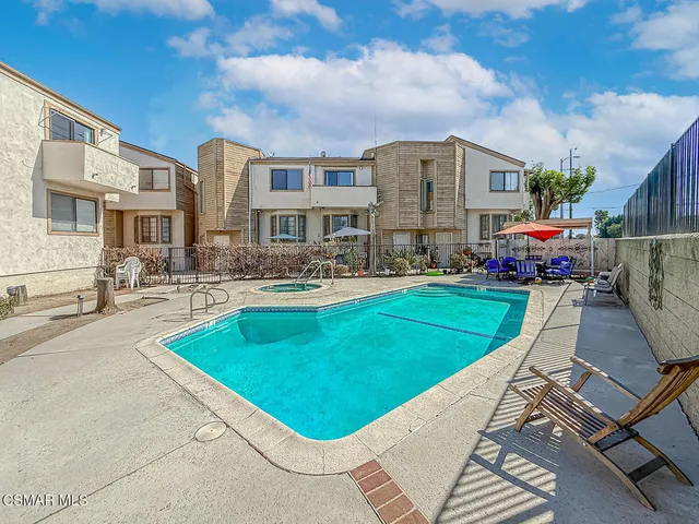 a view of a roof deck with furniture