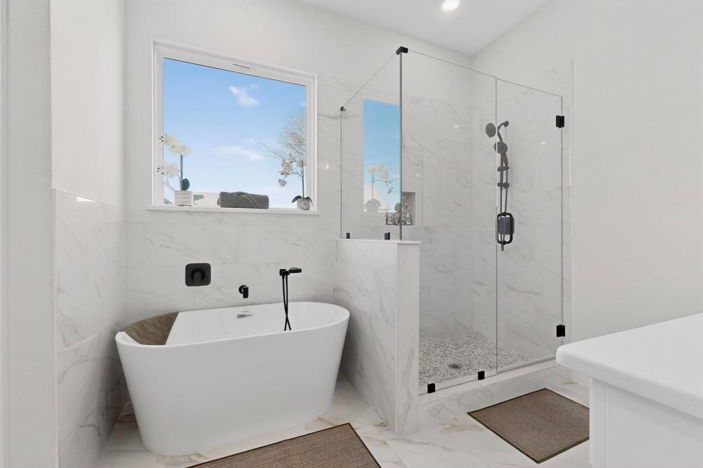 4961 County Road 1098 Celeste, TX 75423 - Photo 20 of 40 Full bathroom featuring a marble finish shower, a freestanding bath, light marble finish floors, recessed lighting, and vanity